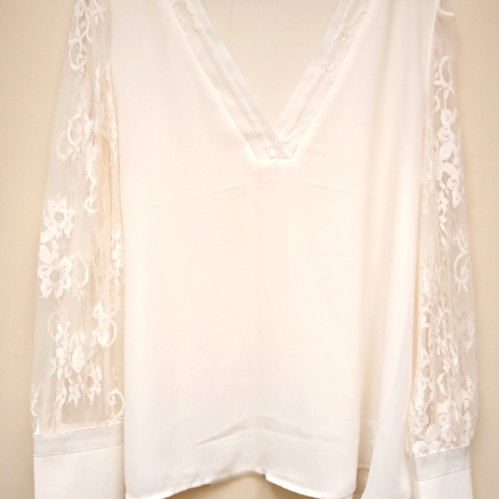 White blouse with lace sleeves